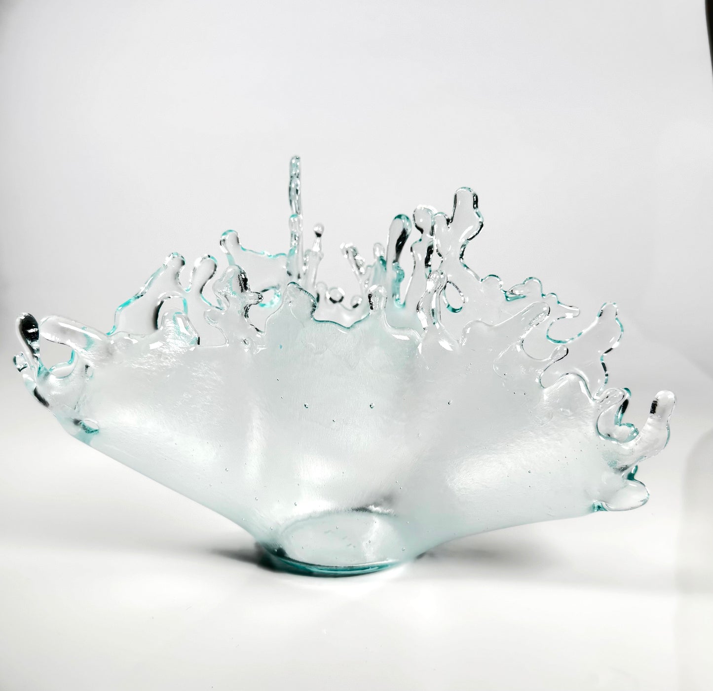 Glass bowl with textured surface on a white background