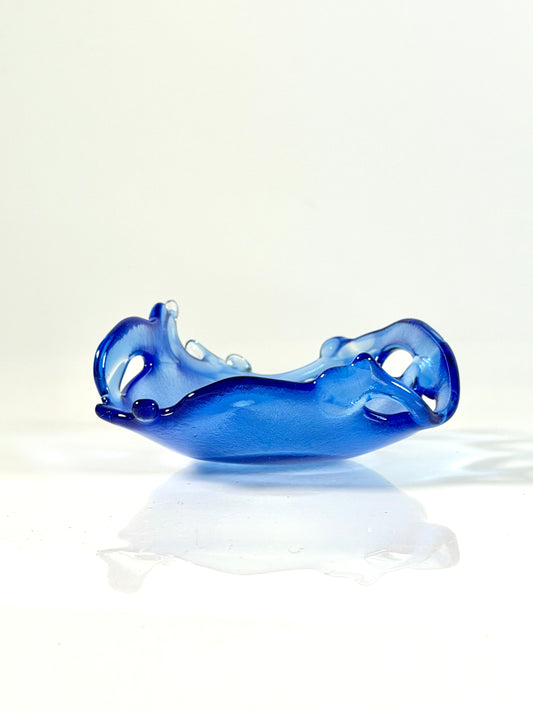 Blue glass bowl on a white background