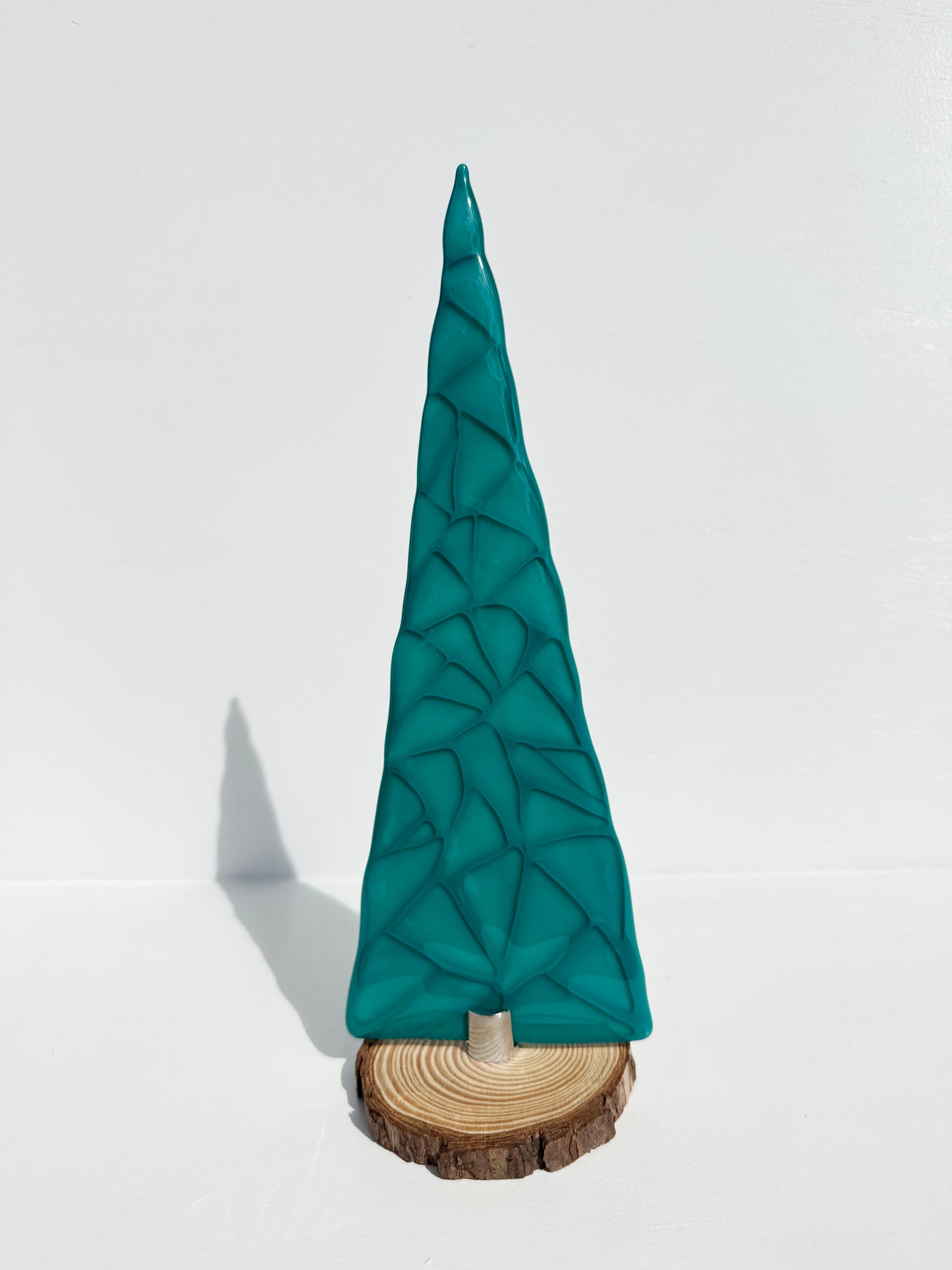 Tall table top tree created with Peacock green and clear glass layered to create depth.