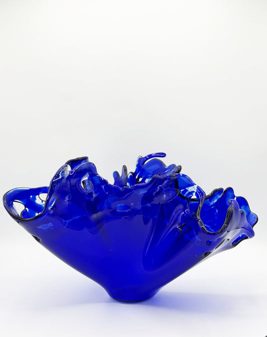 Dark Blue glass sculpture with edge depicting water splashing