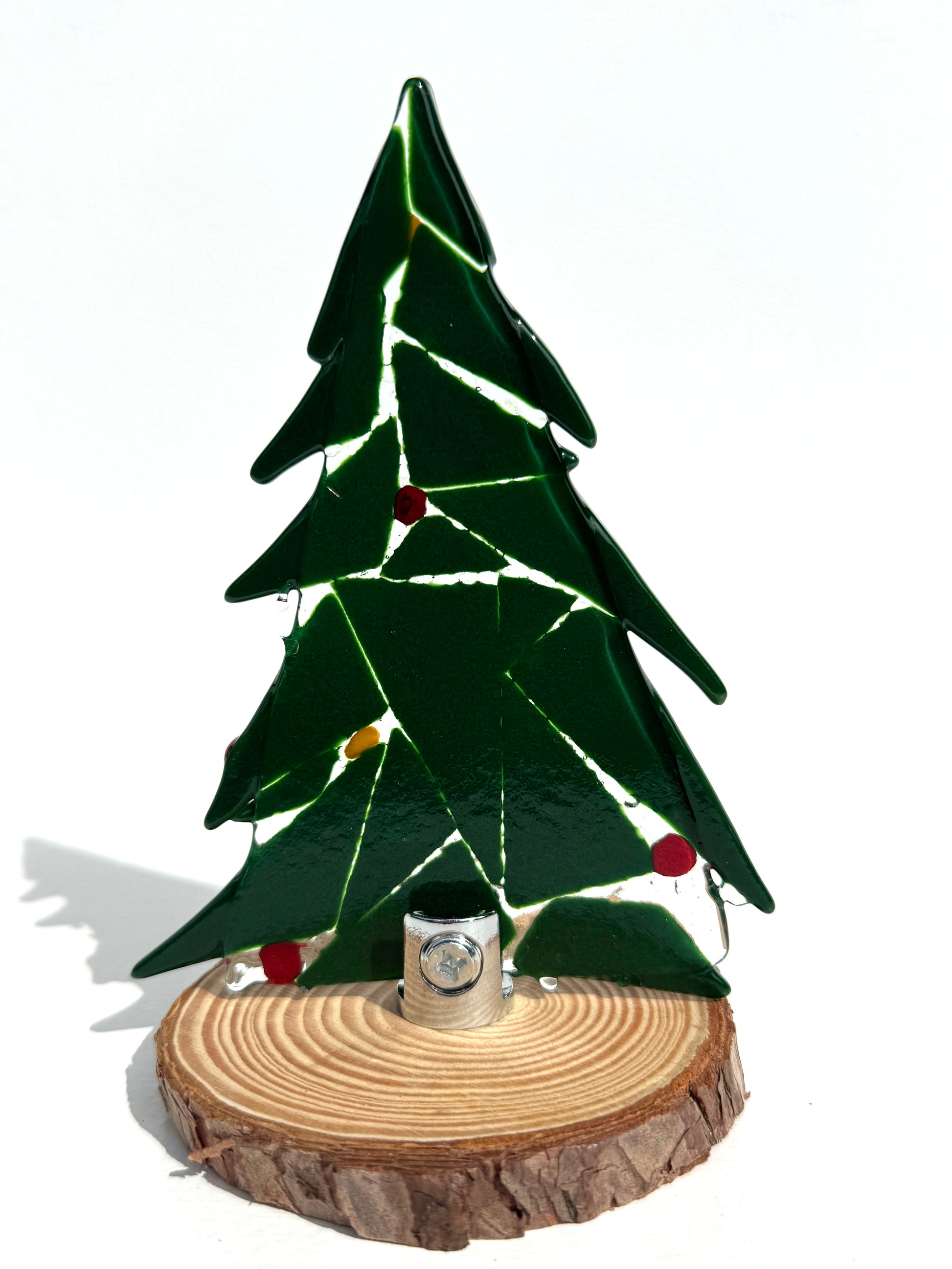 Back of a tree is shown in this image to show how the tree connects to the base and to show the full photo of how they look. 