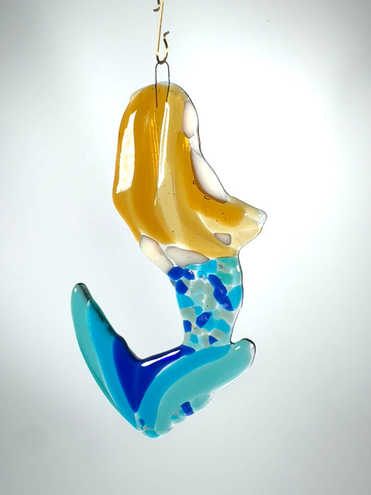 Mermaid with blue tail. Can be hung as ornament or sun-catcher shown with white background