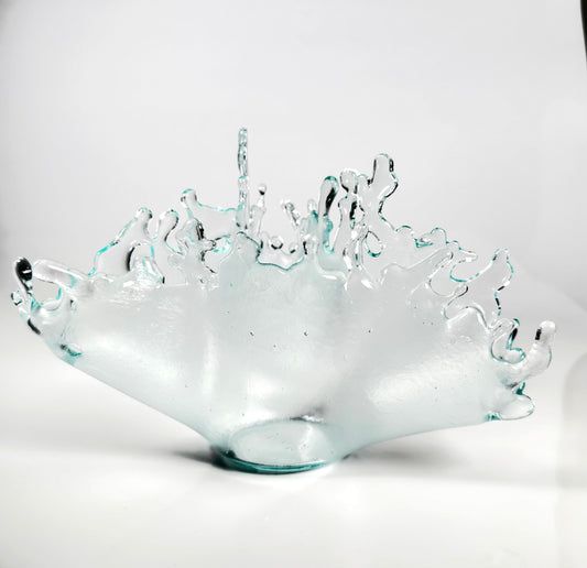Glass bowl with textured surface on a white background