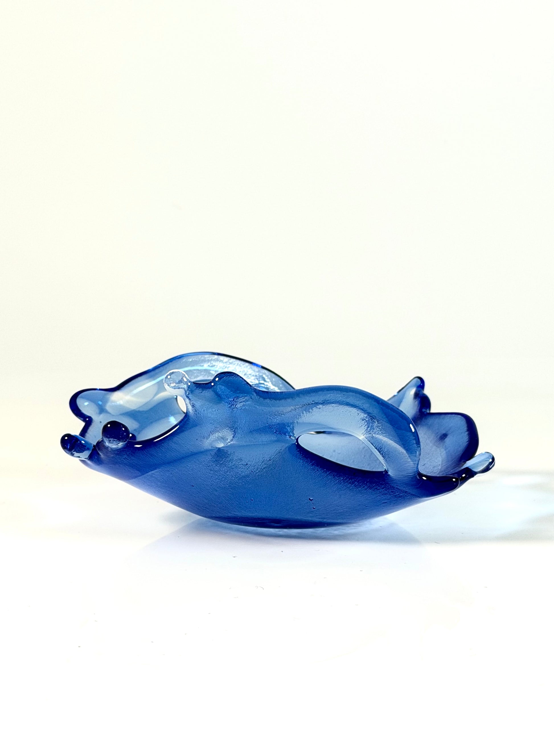 Medium Blue glass bowl on a white background