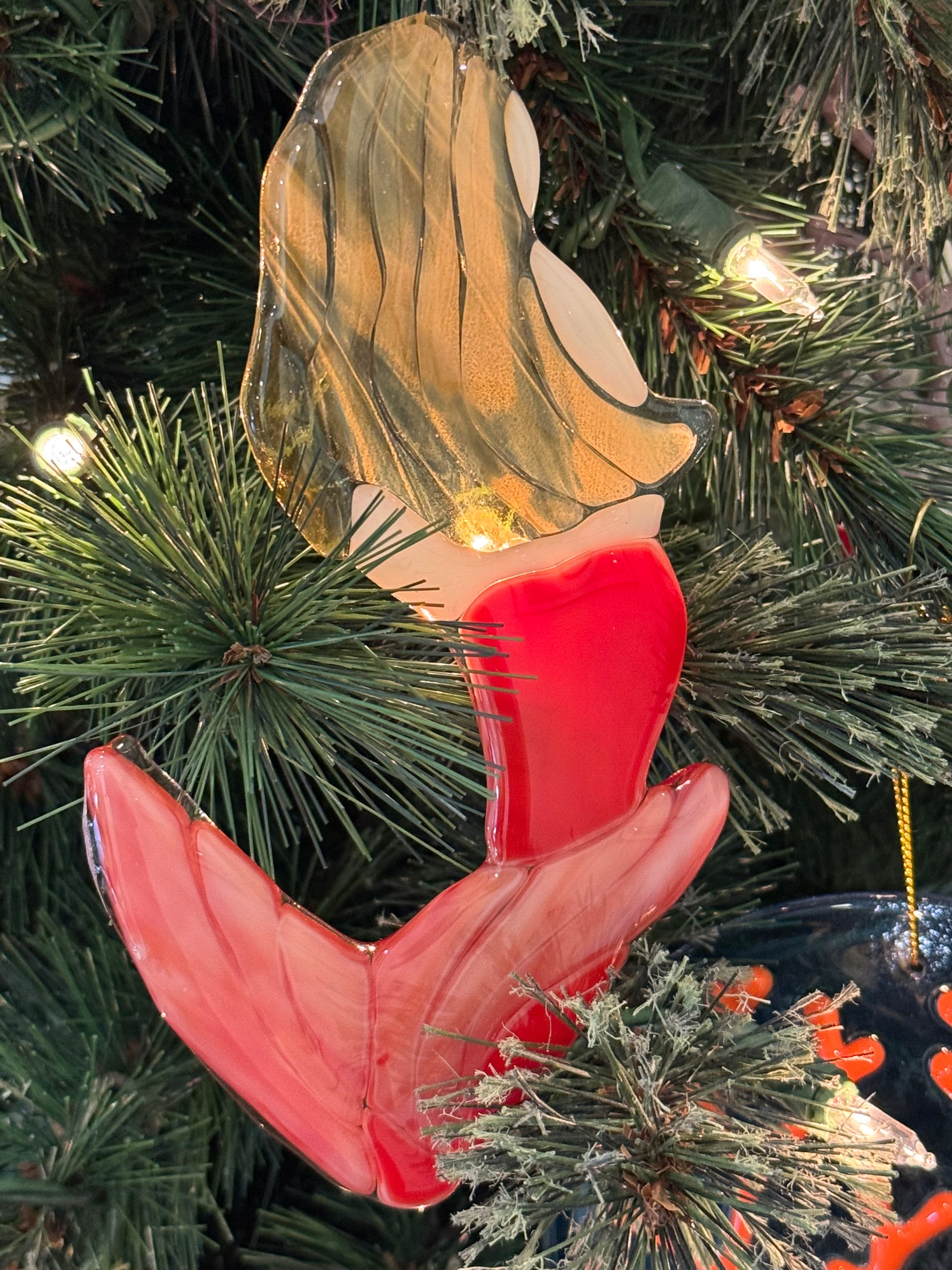 Mermaid suncatcher or ornament hung in a Christmas tree