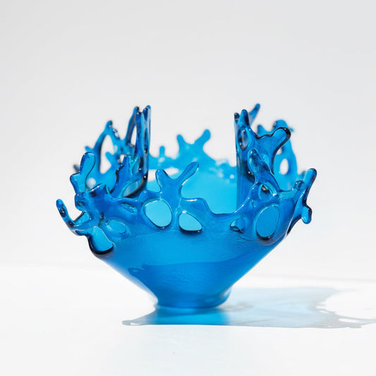 Blue Glass sculpture with unique designs depicting water splashing