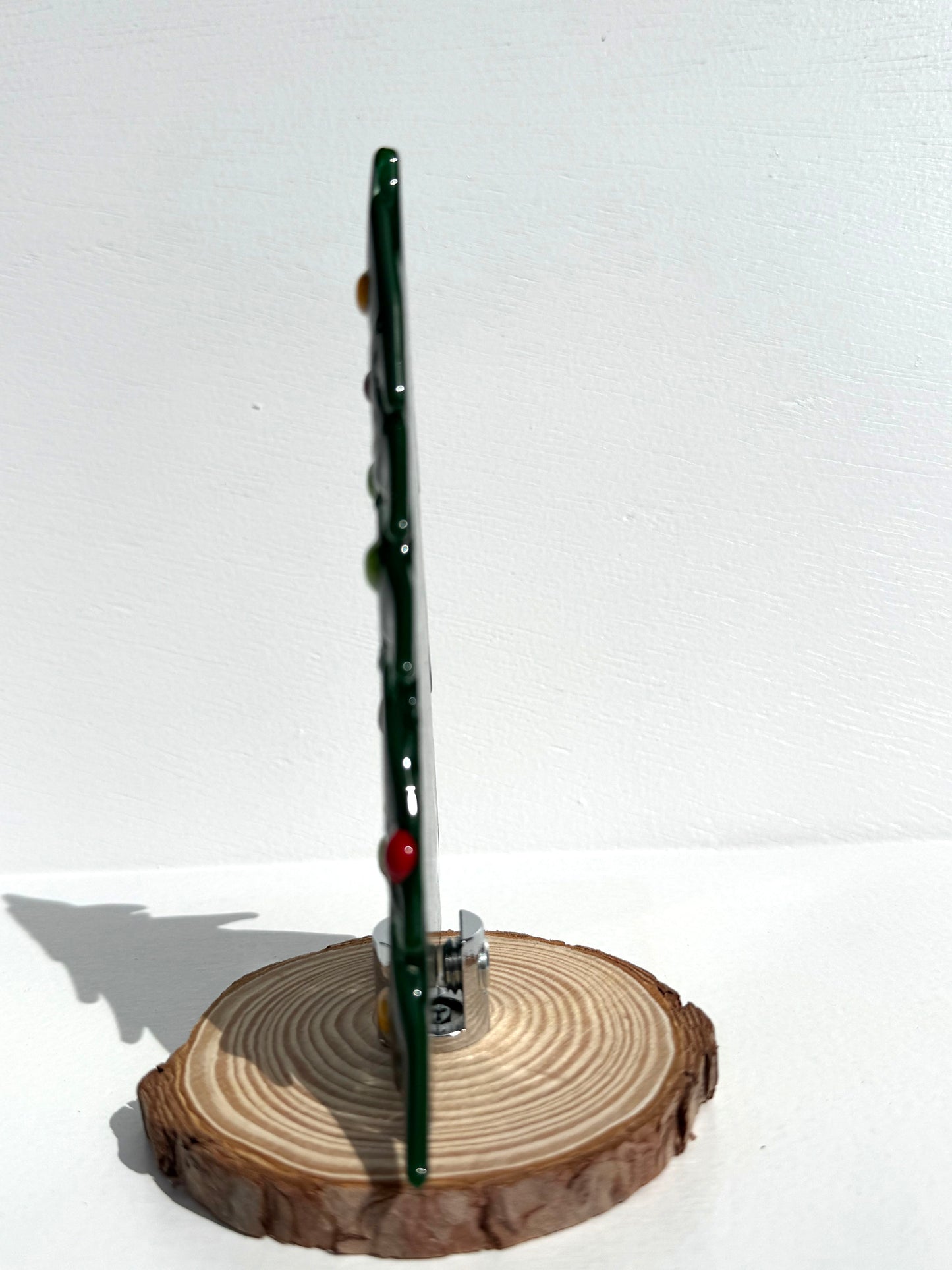Each table top tree is flat allowing for easy storage when removed from base. This image shows a typical side view of a table top tree
