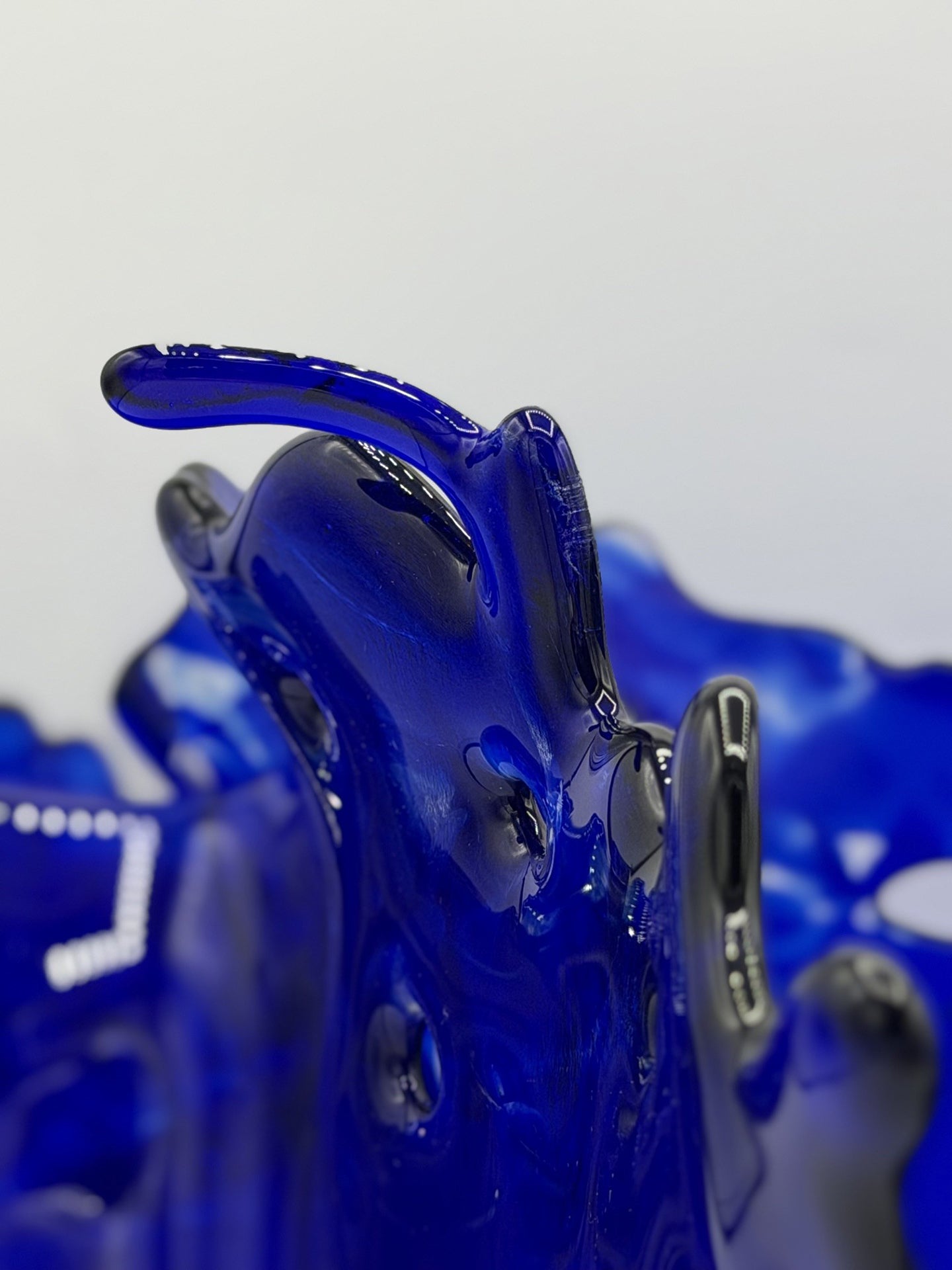 Close-up of Dark Blue splash created from Glass